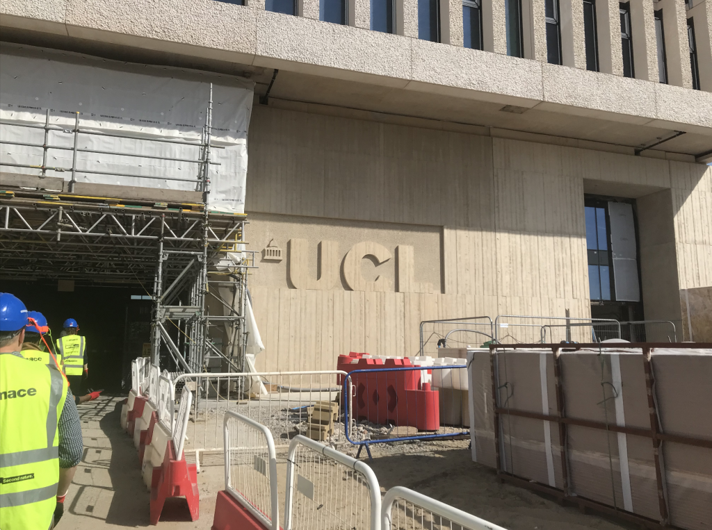UCL name in relief in front entrance of Marshgate building at UCL East